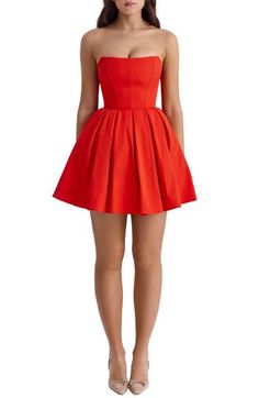 A corseted bodice and strapless silhouette add timeless charm to a fit-and-flare dress cut at a stem-baring length for soirée-ready appeal. Exclusive retailer Hidden back-zip closure Strapless Lined 65% Richcel viscose, 35% polyester Dry clean Imported House Of Cb Dresses Red, Strapless Red Dress Short, Red Leather Mini Dress, Red Corset Dress, Cute Formal Dresses, Pink Ruffle Dress, Red Strapless Dress, Skater Style Dress, Christmas Dresses