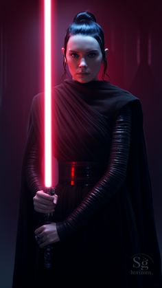 a woman holding a light saber in her hand