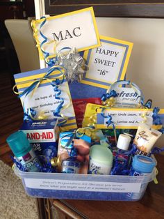 a gift basket filled with personal care products and congratulations cards for someone's birthday