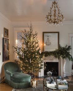 a living room filled with furniture and a christmas tree in the middle of the room