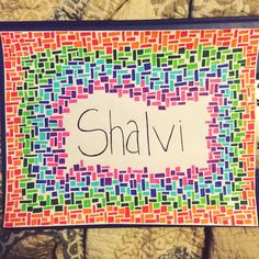 the name shalivi is written on a colorful mosaic tile pattern in black ink