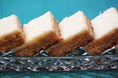 four pieces of cake sitting on top of a glass plate