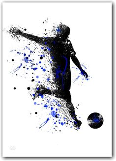 a man kicking a soccer ball with blue splatters on the side of it