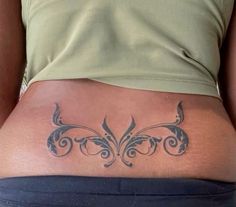 a woman with a tattoo on her stomach