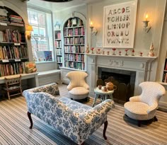 a living room filled with furniture and a fire place in the middle of a room