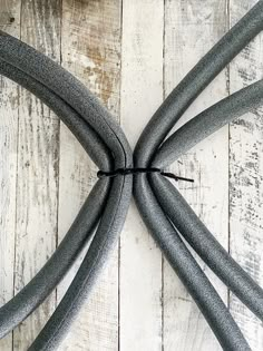 the wires are connected to each other on the white wood floor with planks in the background