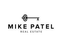 the logo for mike patel real estate, which is located in front of a key