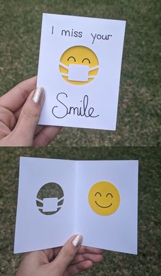 someone is holding two cards with smiley faces on them and the words i miss your smile