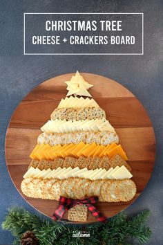 christmas tree cheese and crackers board on a wooden plate