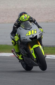 a person riding a motorcycle on a race track