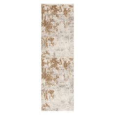 a white and brown rug with an abstract design