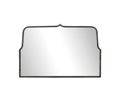 a mirror that is sitting on top of a white wall and has a black border around it