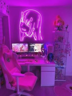 a room with a desk, chair and two computer monitors on it in front of a neon pink wall