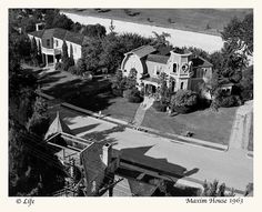 an aerial view of a large house with lots of trees