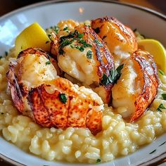 a white plate topped with shrimp and riso