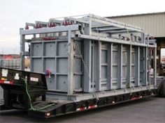 a large truck is parked in front of a building