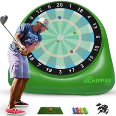 a man hitting a golf ball in front of a green clock with numbers on it