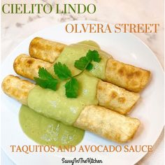 an image of food on a plate with green sauce and cilantro in the background