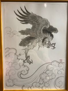 an eagle flying through the sky with clouds