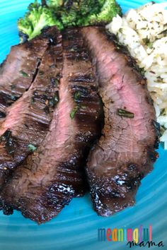 steak, broccoli and rice on a blue plate