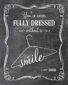 a chalkboard sign that says, you're never fully dressed without a smile