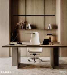 an office desk with a lamp, laptop and other items on it in front of a bookcase