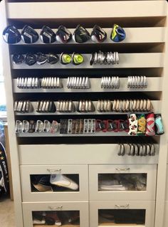 a shoe rack with many pairs of shoes on it