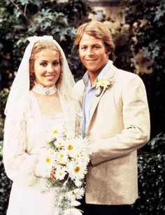 the bride and groom are posing for a photo