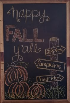 a chalkboard sign that says happy fall y'all apples pumpkins and hay