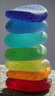 a stack of colorful rocks sitting on top of a table