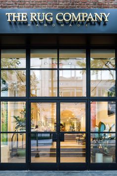 the rug company store front with large glass doors