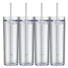 four clear tumbler cups with straws on each one and two empty ones in the middle