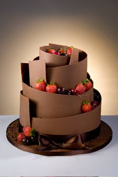 a cake made out of cardboard with strawberries on top