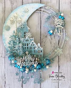 a blue and white christmas card with snowflakes on it