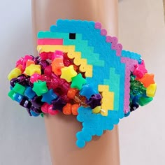 As seen on my YouTube channel Kandi Toybox. You can watch me create this beautiful piece on YT!  Size 9-10 inches  This kandi cuff is made with rainbow pony beads, rainbow stars and dolphin perler. This Item is premade and is ready to ship! Perfect for any event! You will get lots of compliments in this unique wearable art! Stand out at your next event! Birthday party  Edm festival  Raves Rave outfit  Festival outfit Pride Rave birthday  Rave anniversary  Pride Rave gift Rave Style Festival Beaded Bracelets With Colorful Beads, Rave Style Colorful Beaded Bracelets For Festival, Rainbow Beaded Bracelets For Rave, Rave Style Plastic Jewelry For Festivals, Handmade Multicolor Rave Friendship Bracelets, Colorful Handmade Rave Bracelets, Colorful Beaded Rave Bracelets As Gift, Handmade Plastic Bracelets For Festival, Colorful Rave Beaded Bracelets Gift