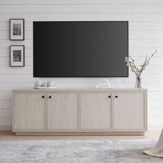 a large flat screen tv mounted to the side of a wall