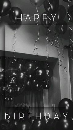 black and white photograph of balloons with the words happy birthday