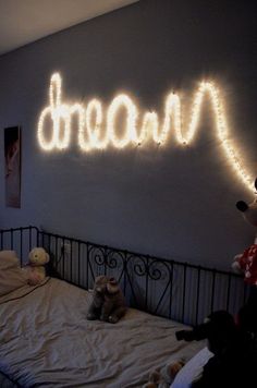 there is a light up sign above the bed