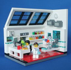 a lego model of a lab with two people standing in front of the lab counter