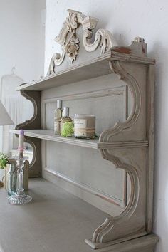 a shelf with some bottles on top of it