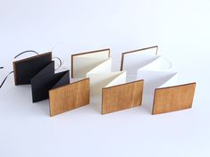 several different types of wooden boxes on a white surface