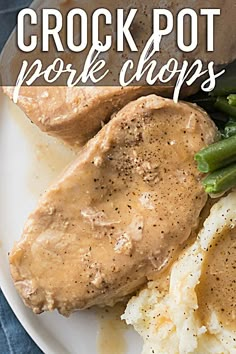 a plate with chicken, mashed potatoes and asparagus on it that says crock pot pork chops