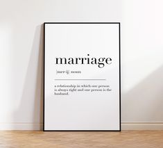 a black and white poster with the words marriage on it next to a wooden floor