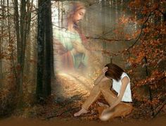 a woman sitting in the woods with her hands on her head and looking at an image of jesus