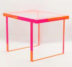 an orange and pink side table on a white background with no one around it or someone else