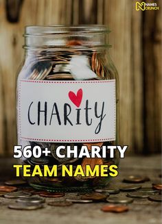 a jar filled with lots of coins sitting on top of a wooden floor next to a sign that says charity