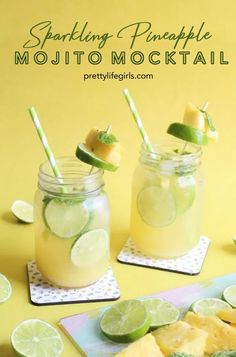 two mason jars filled with pineapple mojito cocktails