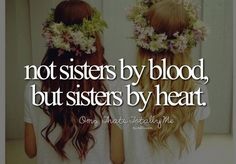 two girls with flowers in their hair and the words not sisters by blood, but sisters by heart