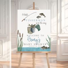 a welcome sign for a baby shower is displayed on an easel