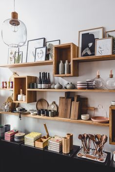 the shelves are filled with various items and pictures on them, including bookshelves